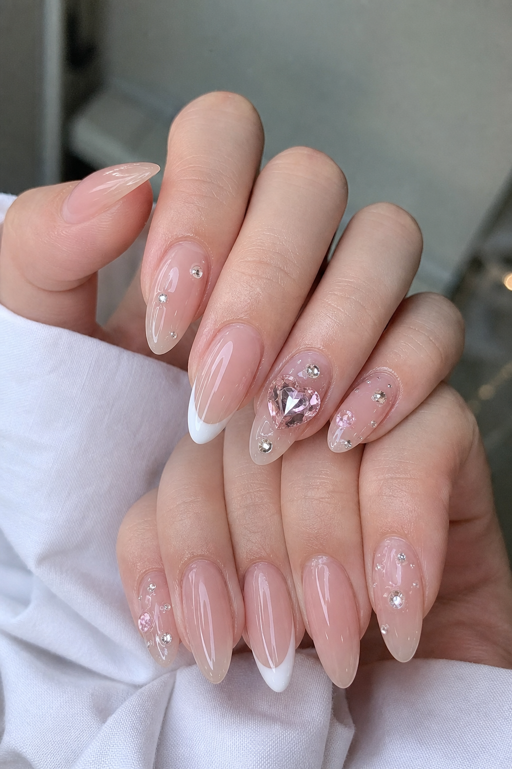 Glossy Sheer Nude And White Almond Nail Design
