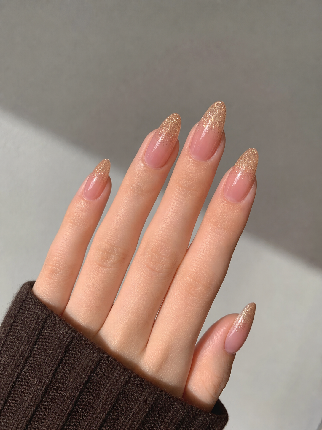 Glossy Pink And Gold Almond Nail Design