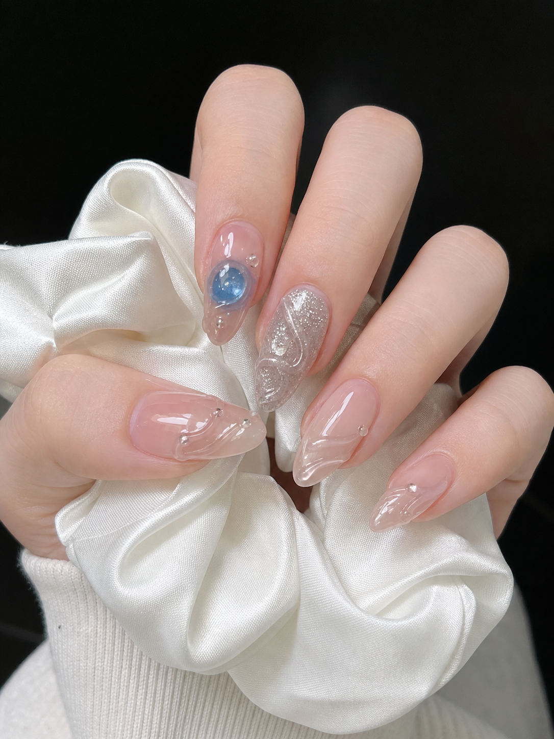 Glossy Sheer Nude And Silver Almond Nail Design