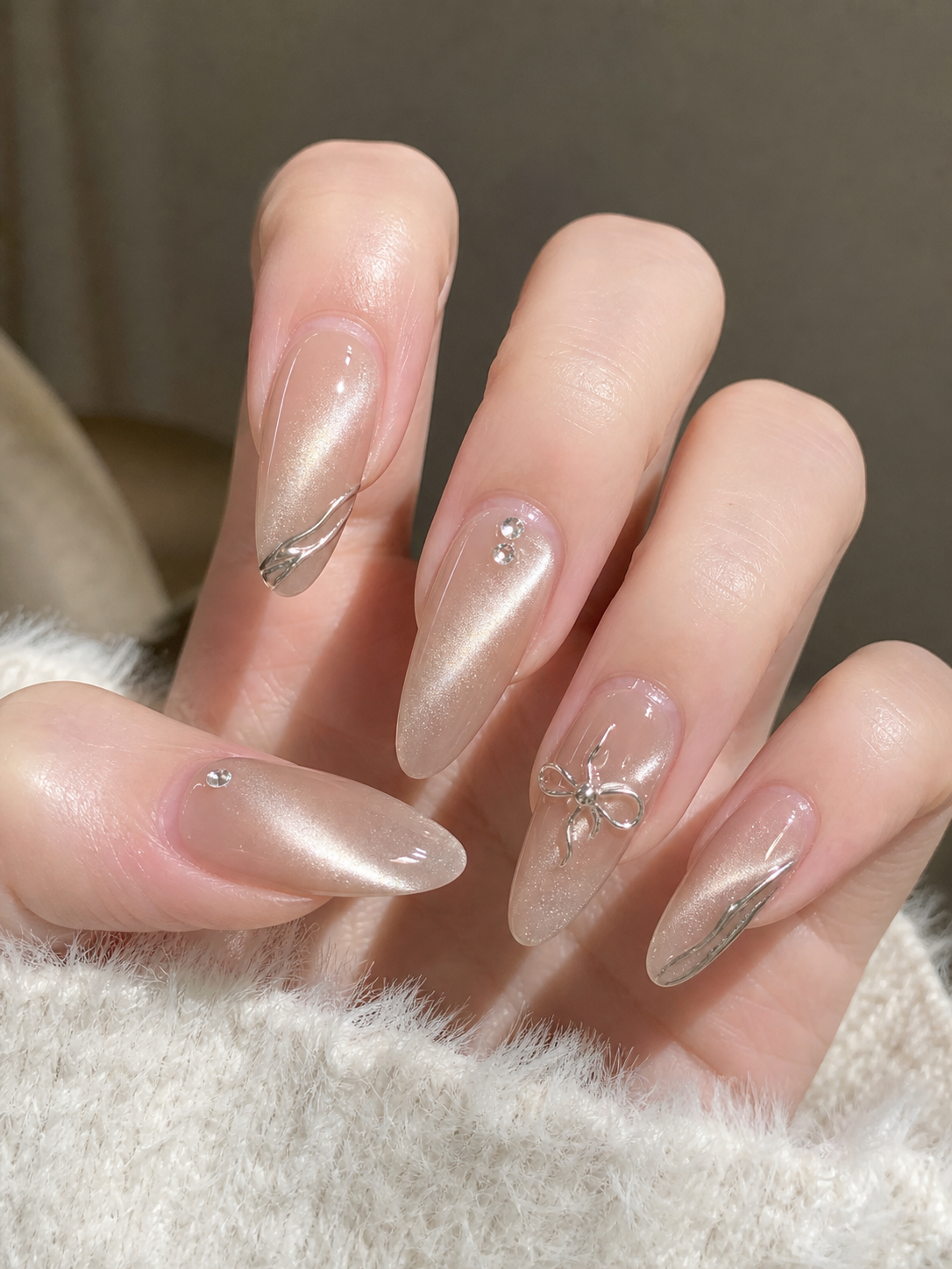 Glossy Sheer Nude And Silver Almond Nail Design