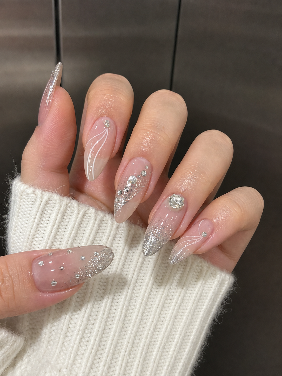 Glossy Sheer Nude And Silver Almond Nail Design