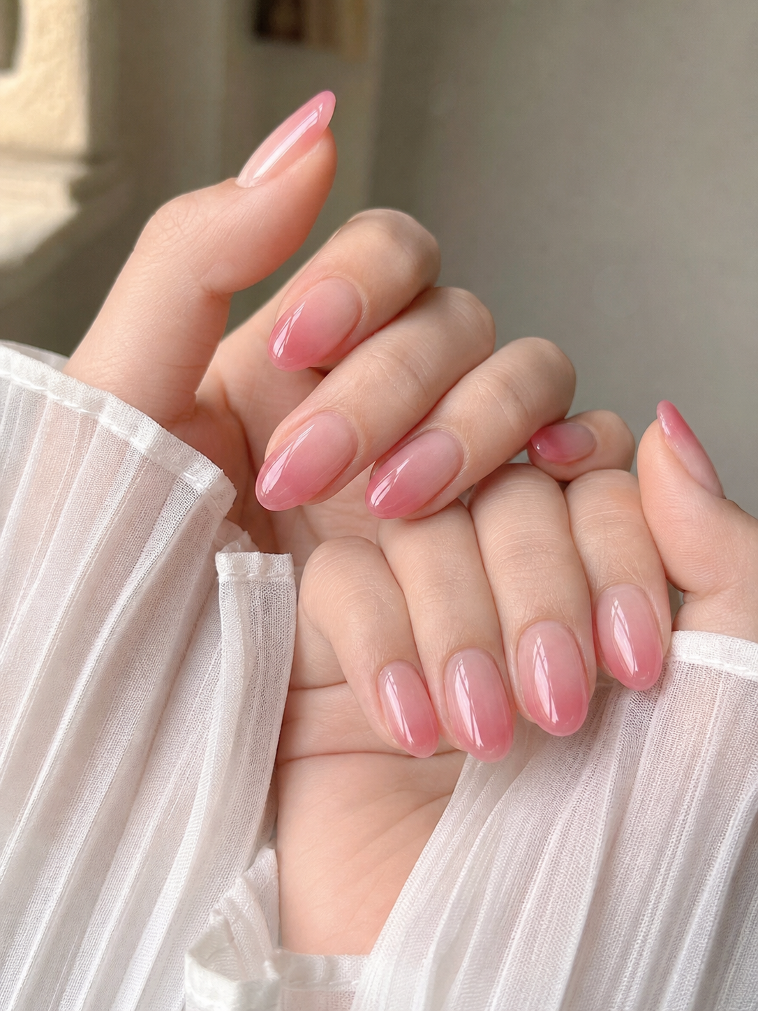 Glossy Pink And Nude Oval Nail Design